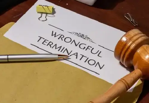 Document Detailing Wrongful Termination on Table